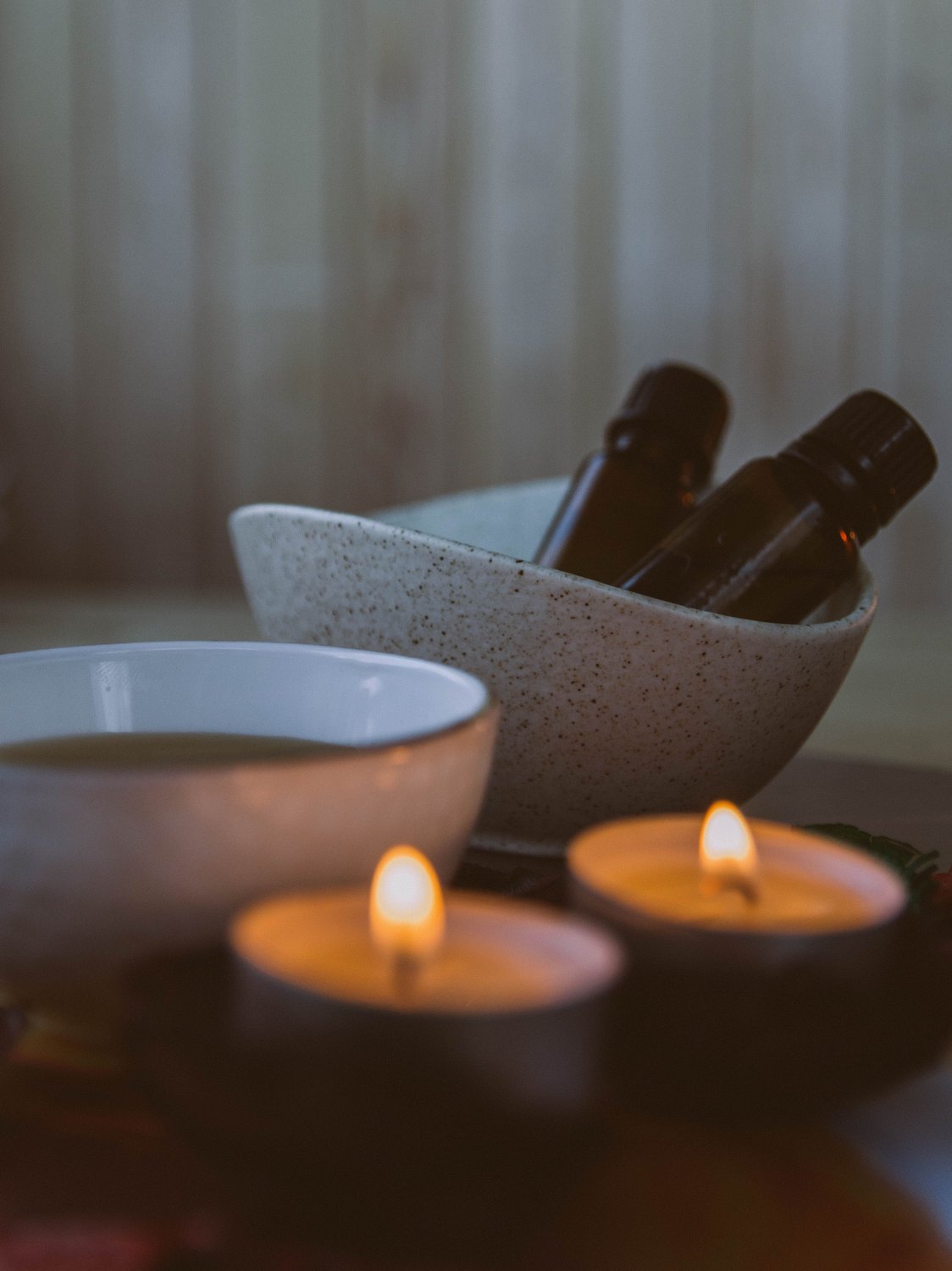 Warm candlelight and massage oils, a calm space for somato emotional release